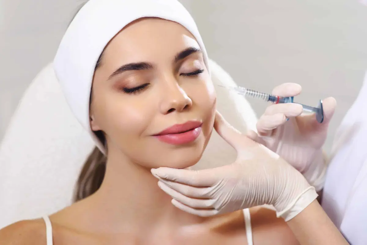 Young Female Getting Xeomin Neurotoxin Treatment in cosmetic clinic | Sculpted Aesthetics in Columbia, SC